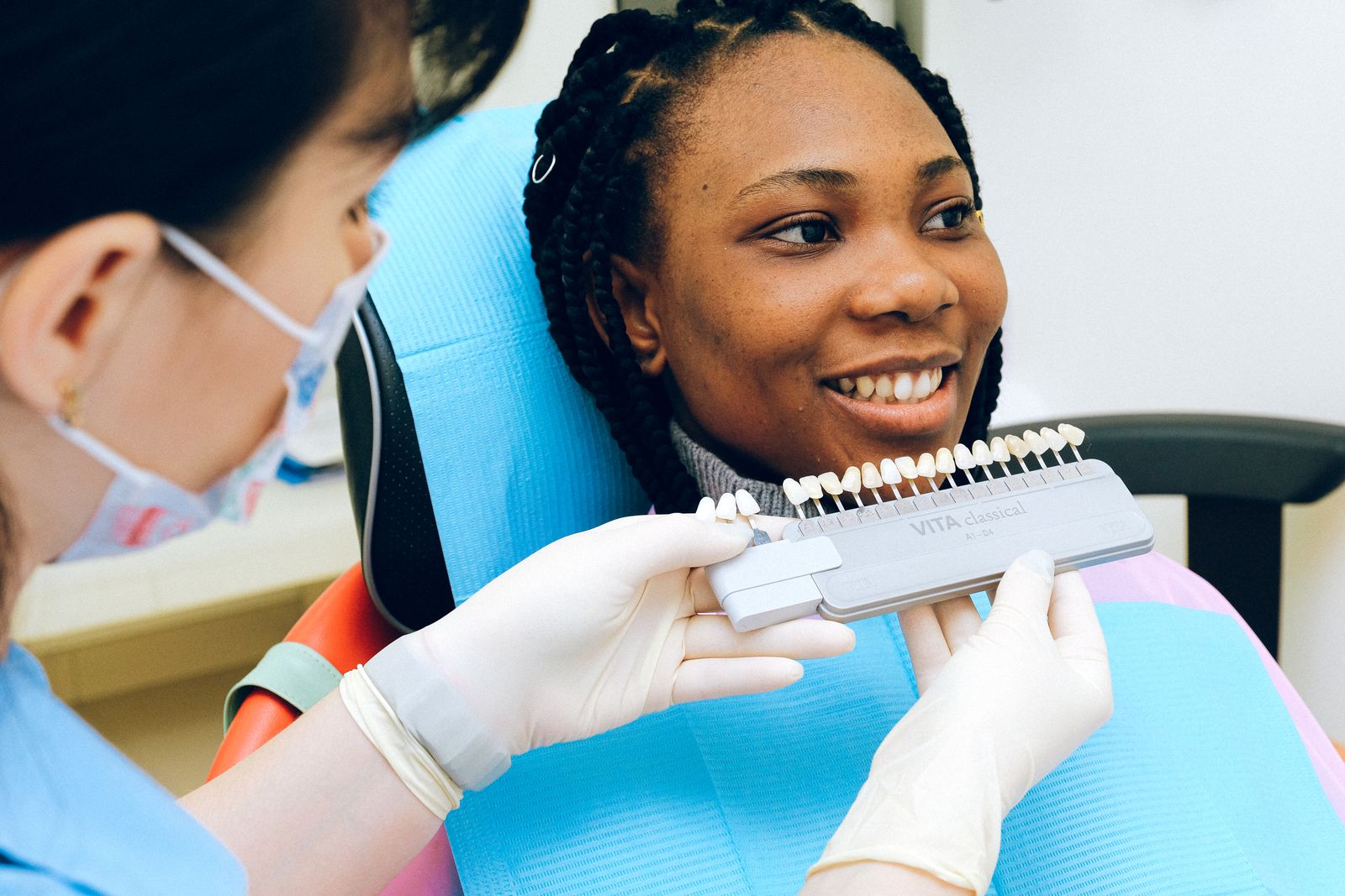 Patient smiling during a dental appointment in a modern clinic